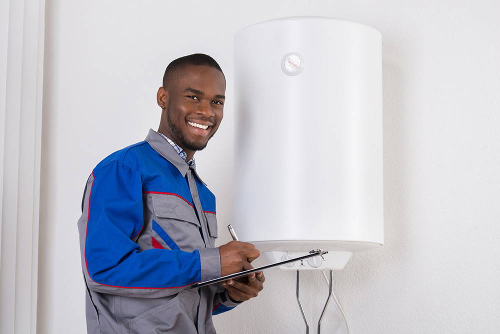 Plumber Looking At Electric Boiler