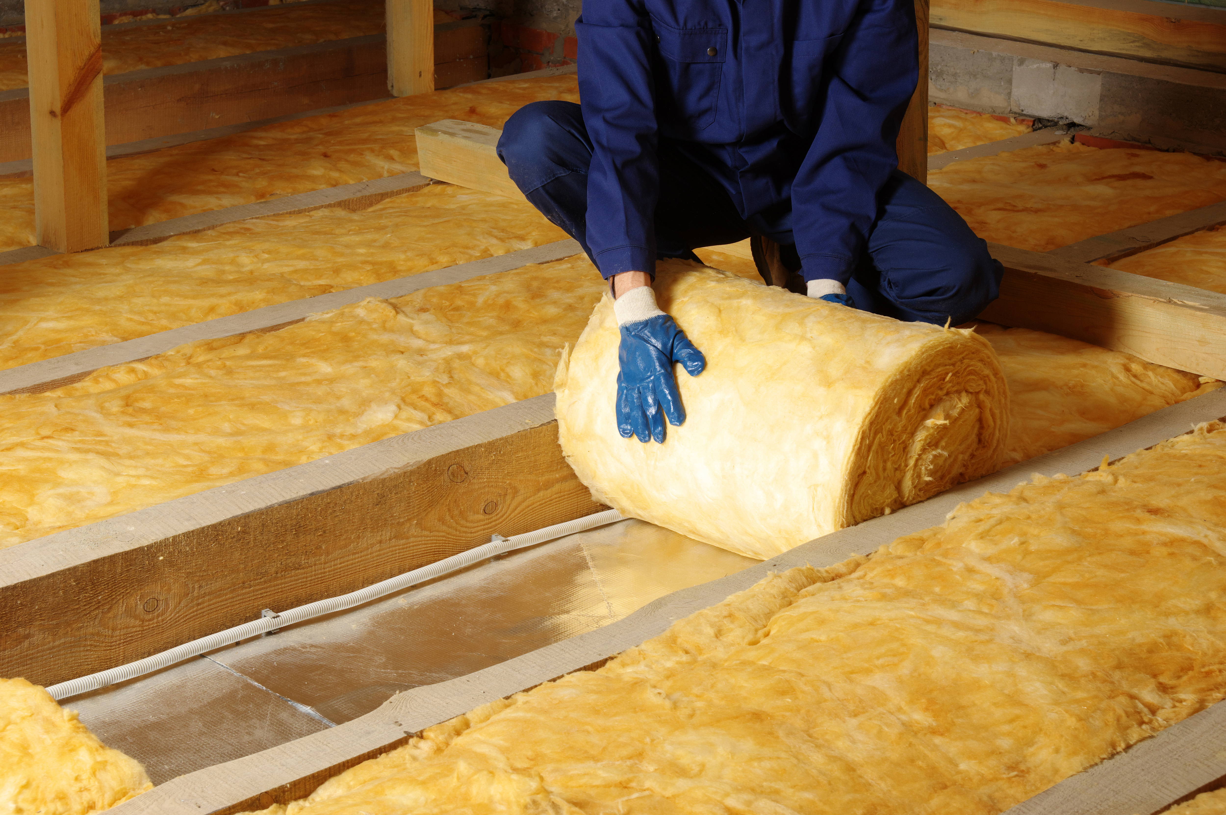 Construction,Worker,Thermally,Insulating,House,Attic,With,Glass,Wool